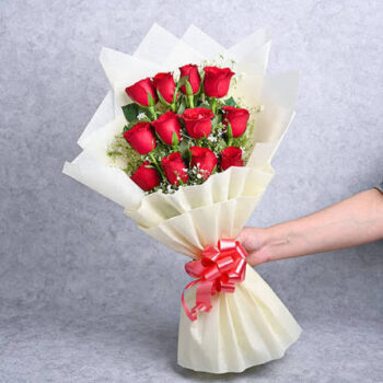 12 red roses with white paper packing